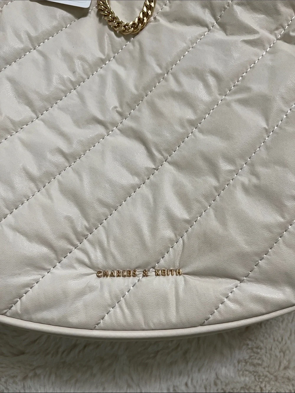 Charles & Keith Cream Quilted Crescent Bag with Gold Chains